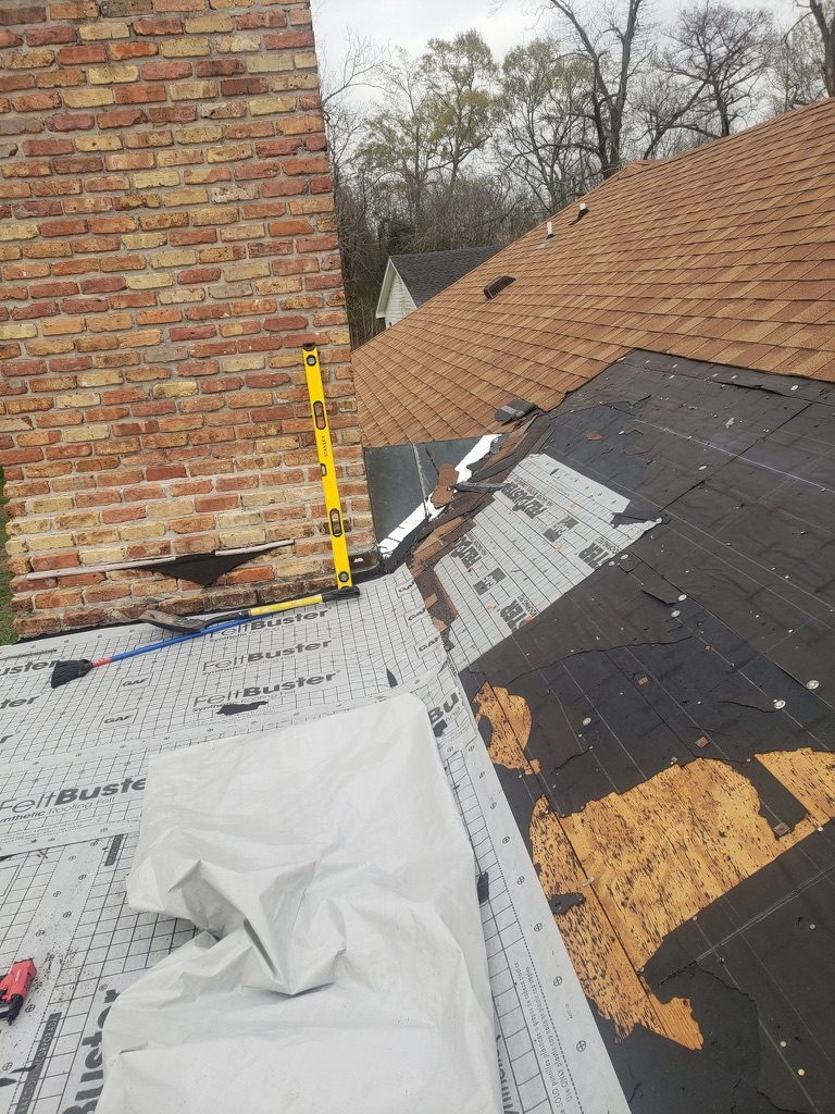 Chimney flashing repair during a roof replacement
