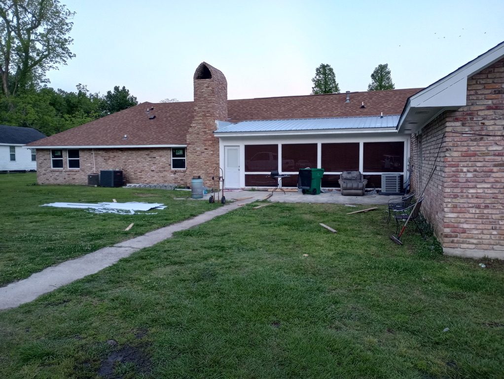Rear porch addition with new metal patio roof